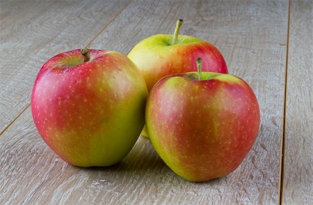 simsearch:400-07096505,k - Three apples on a wooden table Stock Photo - Budget Royalty-Free & Subscription, Code: 400-04925664