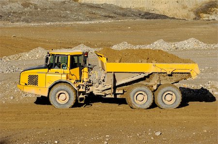 simsearch:400-04274028,k - A yellow dump truck is driving in mine Stock Photo - Budget Royalty-Free & Subscription, Code: 400-04920769