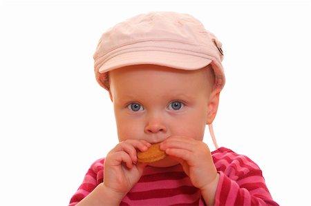simsearch:400-04594888,k - Portrait of a toddler eating a cookie on white background Stock Photo - Budget Royalty-Free & Subscription, Code: 400-04920932