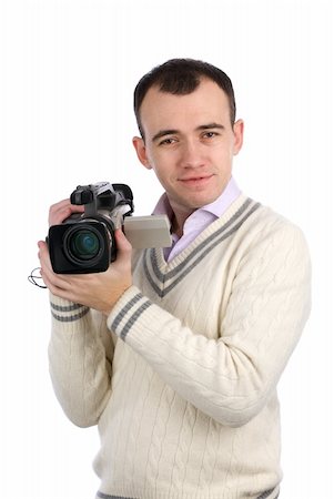 A young man holding a camcorder isolated on a white background Stock Photo - Budget Royalty-Free & Subscription, Code: 400-04921458