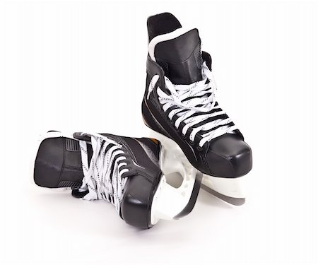 Pair of hockey skates isolated on white background Stock Photo - Budget Royalty-Free & Subscription, Code: 400-04923678