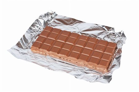 simsearch:400-05136453,k - Block of fine chocolate on white background. Shallow DOF Stock Photo - Budget Royalty-Free & Subscription, Code: 400-04934727