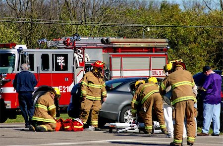 firefighter rescue truck - Fire fighters at work on the scene of accident Stock Photo - Budget Royalty-Free & Subscription, Code: 400-04935638