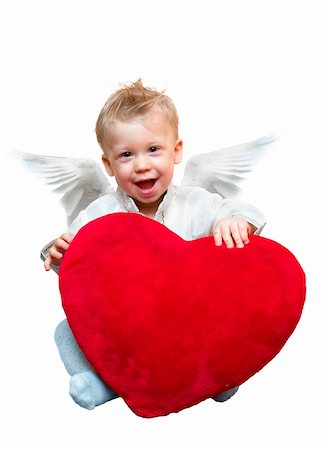 Laughing cute angel boy with big plush red heart. Isolated on white background Stock Photo - Budget Royalty-Free & Subscription, Code: 400-04937534