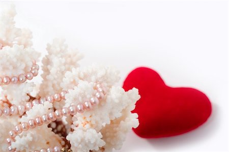 staghorn coral - pearl beads, corals and red velvet heart on white background with copy space in the top right corner. Focal point is on the pearls, heart is out of focus. Stock Photo - Budget Royalty-Free & Subscription, Code: 400-04937865