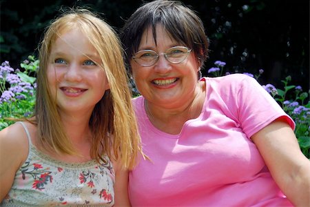 Grandmother and granddaughter laughing in the garden Stock Photo - Budget Royalty-Free & Subscription, Code: 400-04939165