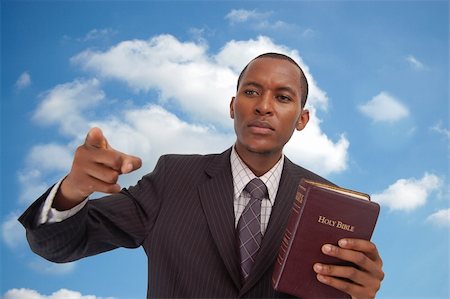 evangelist - This is an image of man holding a bible against a cloud/sky background. This image can be used to represent "Heavenly Message","sermon", "preaching" etc... Stock Photo - Budget Royalty-Free & Subscription, Code: 400-04932224