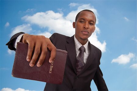 evangelist - This is an image of man holding a bible. This image can be used to represent "Heavenly message", "sermon", "preaching" etc... Stock Photo - Budget Royalty-Free & Subscription, Code: 400-04932225