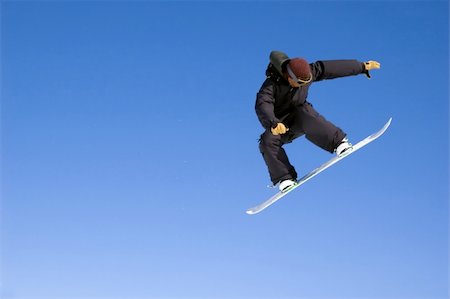 simsearch:400-03985663,k - a snowboarder jumping high through a blue sky Stock Photo - Budget Royalty-Free & Subscription, Code: 400-04940334