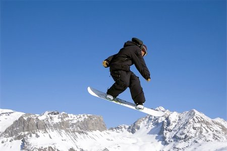 simsearch:400-03985663,k - a snowboarder jumping high through a blue sky Stock Photo - Budget Royalty-Free & Subscription, Code: 400-04940333
