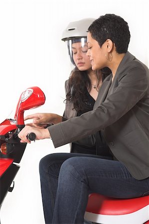 scooter with white background - couple girls talking on  scooter over white background Stock Photo - Budget Royalty-Free & Subscription, Code: 400-04941147