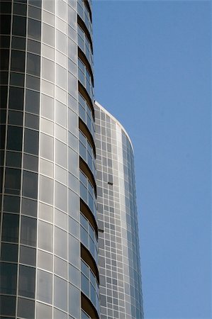 simsearch:400-04671558,k - Modern skyscrapers against a bright blue sky Foto de stock - Super Valor sin royalties y Suscripción, Código: 400-04941512