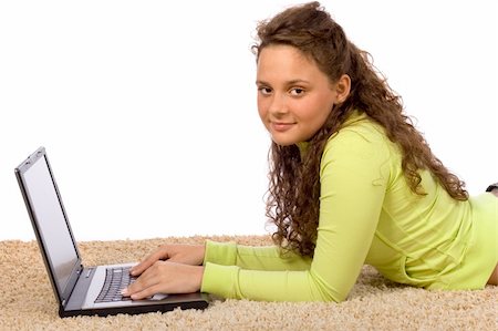 isolated on white female teenager lying on the carpet with laptop Stock Photo - Budget Royalty-Free & Subscription, Code: 400-04942103