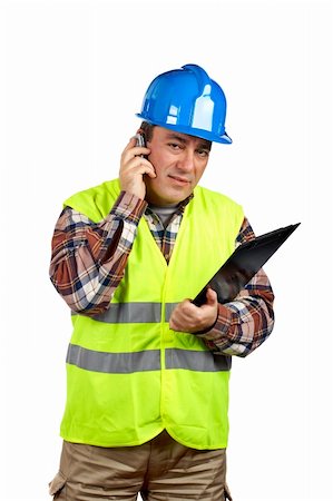 simsearch:400-06632132,k - Construction worker with green safety vest talking with cell phone Stock Photo - Budget Royalty-Free & Subscription, Code: 400-04942720