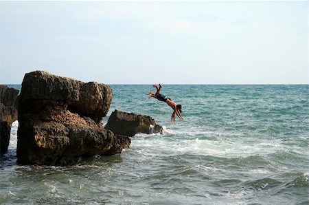 two men jumping into the water in Croatia Stock Photo - Budget Royalty-Free & Subscription, Code: 400-04943774