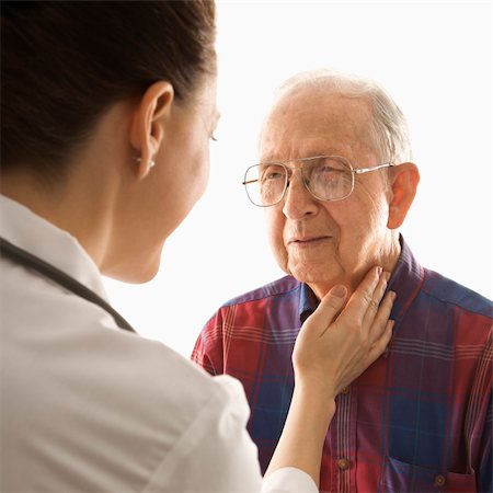 Mid-adult Caucasian female doctor checking an elderly Caucasian male's pulse. Stock Photo - Budget Royalty-Free & Subscription, Code: 400-04954627