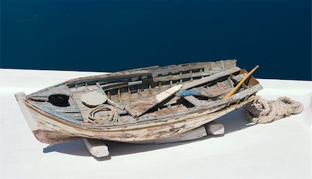 Old damaged rowing boat withpaddles and rope Stock Photo - Budget Royalty-Free & Subscription, Code: 400-04954861