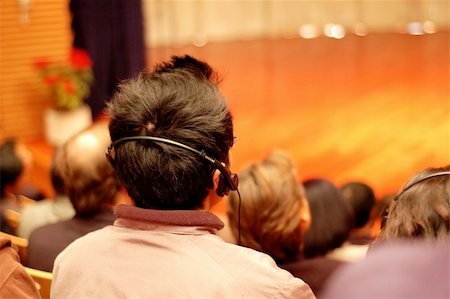 simsearch:632-05604064,k - The audience wearing head phone for online translation Stock Photo - Budget Royalty-Free & Subscription, Code: 400-04955404