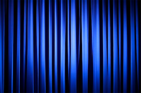 Spotlight on  A Blue Theater Curtain Before Show Begins Stock Photo - Budget Royalty-Free & Subscription, Code: 400-04955598