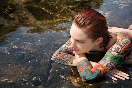 simsearch:400-04450827,k - Sexy nude tattooed Caucasian woman lying in tidal pool in Maui, Hawaii, USA. Stock Photo - Budget Royalty-Free & Subscription, Code: 400-04955748