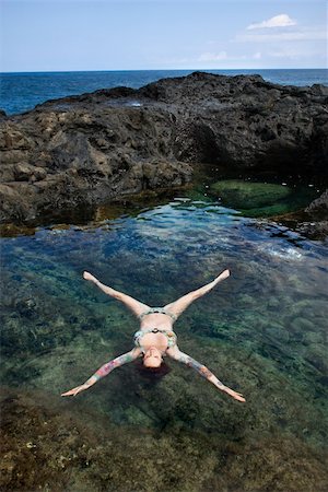 simsearch:400-04450827,k - Sexy Caucasian woman in bikini floating in tidal pool in Maui, Hawaii, USA. Stock Photo - Budget Royalty-Free & Subscription, Code: 400-04955743