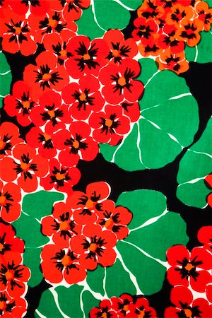 Close-up of vintage fabric with vibrant red geraniums and green leaves printed on polyester. Photographie de stock - Aubaine LD & Abonnement, Code: 400-04956267