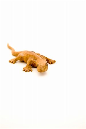 salamander - Wooden lizard handmade in Thailand. Photographed against a white background.Shallow DOF Stock Photo - Budget Royalty-Free & Subscription, Code: 400-04957803