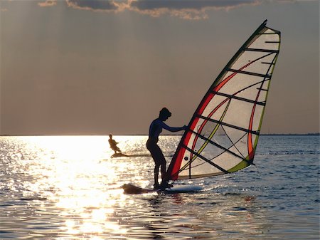 simsearch:400-03992760,k - A women is learning windsurfing at the sunset Stock Photo - Budget Royalty-Free & Subscription, Code: 400-04952027