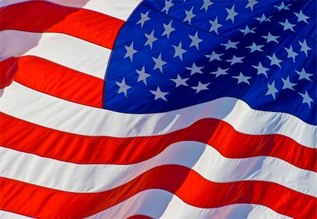 simsearch:400-06086537,k - Tilted stars and stripes flying in the wind on nice background for a patriotic display Stock Photo - Budget Royalty-Free & Subscription, Code: 400-04952213