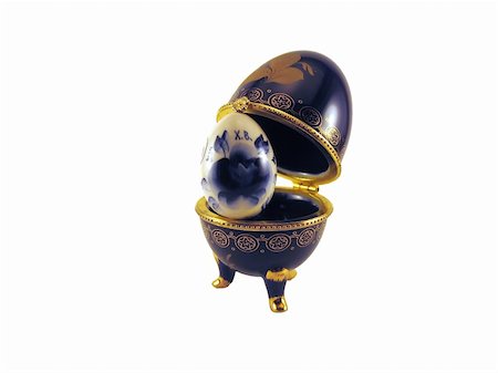 Dark blue easter egg in a gold small box on a white background Stock Photo - Budget Royalty-Free & Subscription, Code: 400-04964320