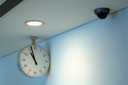 The clock and security camera of corridor ceiling Stock Photo - Budget Royalty-Free & Subscription, Code: 400-04964427