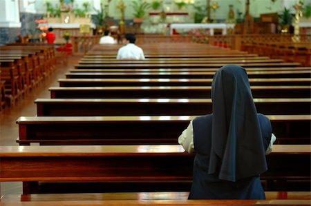 praying catholic nun - A back view of praying sister inside church Stock Photo - Budget Royalty-Free & Subscription, Code: 400-04964444