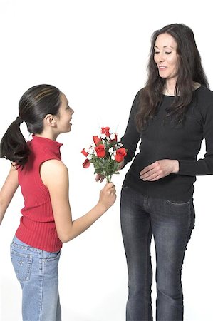 daughter offering flowers to her mother Foto de stock - Super Valor sin royalties y Suscripción, Código: 400-04967372