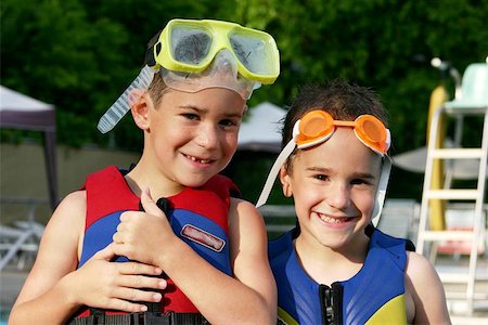 boys at the pool with life jackets and goggles Stock Photo - Budget Royalty-Free & Subscription, Code: 400-04974326