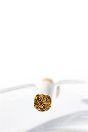 simsearch:400-06761272,k - Cigarette in ash tray Stock Photo - Budget Royalty-Free & Subscription, Code: 400-04976005