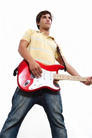 simsearch:400-05092659,k - Portrait of male teen guitarist playing with attutude - isolated Stock Photo - Budget Royalty-Free & Subscription, Code: 400-04985682