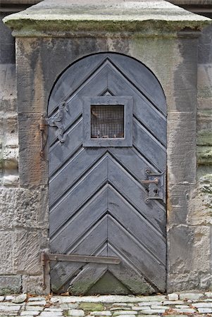 Old church door with a window at level of eyes. Stock Photo - Budget Royalty-Free & Subscription, Code: 400-04987066