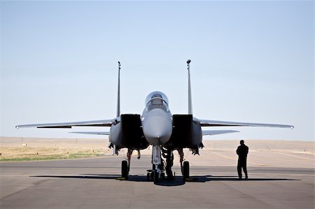 servicing a plane - military aircraft - F-15 strike eagle on tarmac with pilot and technician Stock Photo - Budget Royalty-Free & Subscription, Code: 400-04980809