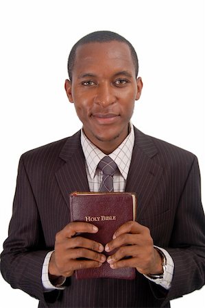 evangelist - This is an image of a man holding a Bible to demonstrate his commitment to his faith. This image can be used to represent "Pastor", "Christian Faith" etc.. Stock Photo - Budget Royalty-Free & Subscription, Code: 400-04981038
