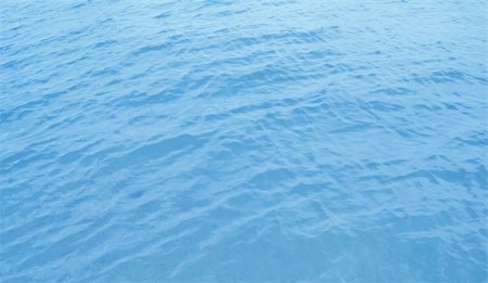 simsearch:400-04058760,k - Beautiful blue rippled sea water surface with sun reflections Photographie de stock - Aubaine LD & Abonnement, Code: 400-04983260