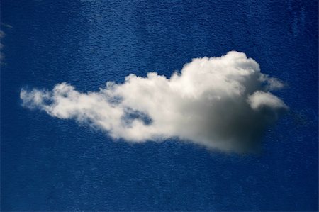simsearch:400-06172579,k - fluffy white cloud isolated on rought blue textured background Stock Photo - Budget Royalty-Free & Subscription, Code: 400-04983702