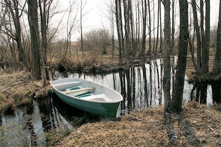 blue boat in stream Stock Photo - Budget Royalty-Free & Subscription, Code: 400-04983761