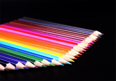 simsearch:400-04046903,k - Colorful pencils in an angle row isolated over black background Stock Photo - Budget Royalty-Free & Subscription, Code: 400-04998092