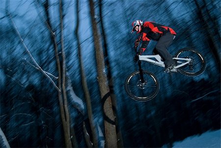 The young man jumps on a bicycle from a springboard Stock Photo - Budget Royalty-Free & Subscription, Code: 400-04993141