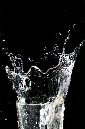 simsearch:400-05275951,k - splash in glass on dark background Stock Photo - Budget Royalty-Free & Subscription, Code: 400-04993422