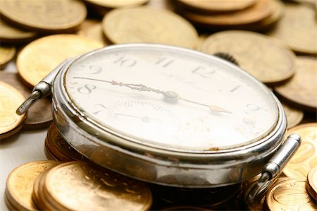 simsearch:700-05803434,k - time is money coins and clock macro concet Stock Photo - Budget Royalty-Free & Subscription, Code: 400-05007249