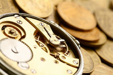 simsearch:700-05803434,k - time is money coins and clock macro concept Stock Photo - Budget Royalty-Free & Subscription, Code: 400-05007871