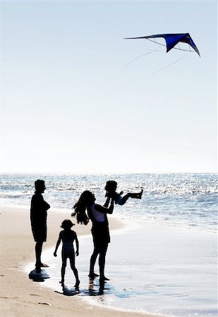 parent child kite - Happy family on the beach Stock Photo - Budget Royalty-Free & Subscription, Code: 400-05014755