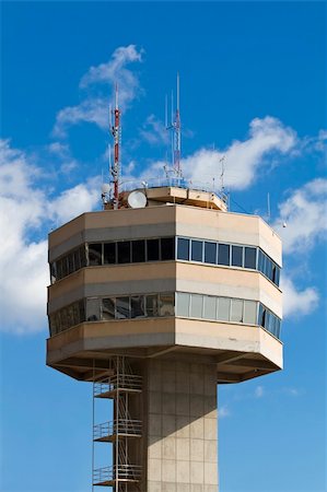 radar parabolic antenna - Telecommunications tower against blue clouded sky. Stock Photo - Budget Royalty-Free & Subscription, Code: 400-05019723