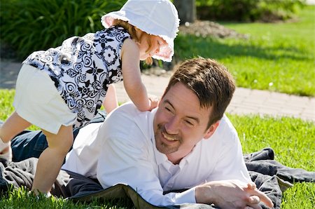 Father and Daughter Having a Good Time Playing Stock Photo - Budget Royalty-Free & Subscription, Code: 400-05010491